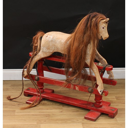 2018 - An early 20th century Lines Brothers rocking horse of small proportions, the stripped and carved woo... 