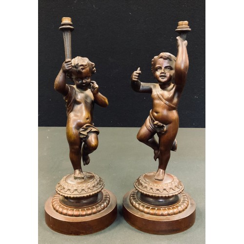 4 - A pair of Bronze Cherub table lamps, cast stepped bases, design lozenge, 27cm high