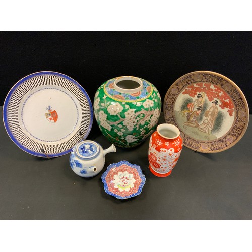 13 - A Chinese Armorial circular plate, mid 19th century;  a Chinese ginger jar;  a Japanese Kutani vase;... 