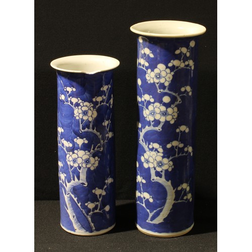 22 - A Chinese cylindrical blue and white painted Prunus pattern vase, 30cm, cylindrical marks; another s... 
