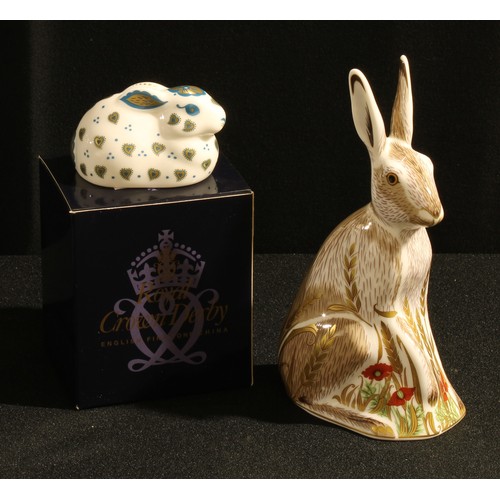 34 - A Royal Crown Derby paperweight, Midsummer Hare, silver stopper; another, Fletchers Rabbit, silver s... 