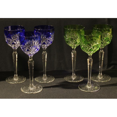 23 - A set of six green and blue flashed hock glasses, star and sheaf cut, faceted tapering stems, 21cm