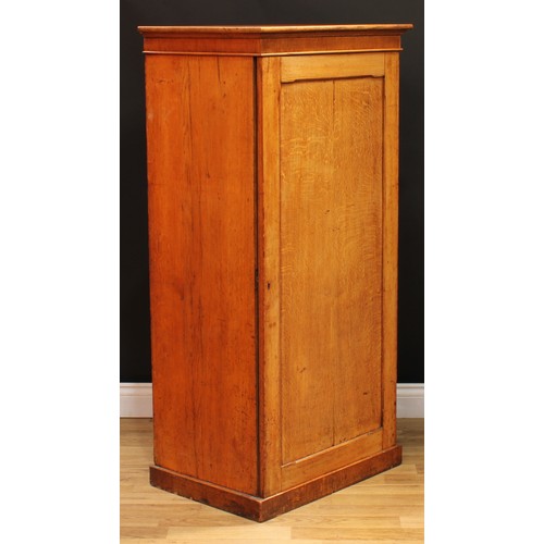 1 - A late Victorian oak estate office enclosed filing cabinet, slightly oversailing rectangular top abo... 