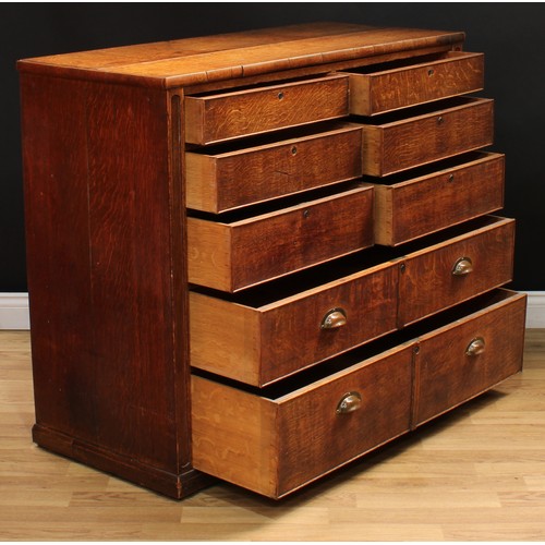 2 - A Victorian oak estate office chest, slightly oversailing rectangular top above six short secure coc... 