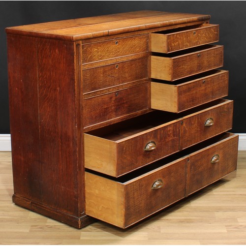 2 - A Victorian oak estate office chest, slightly oversailing rectangular top above six short secure coc... 
