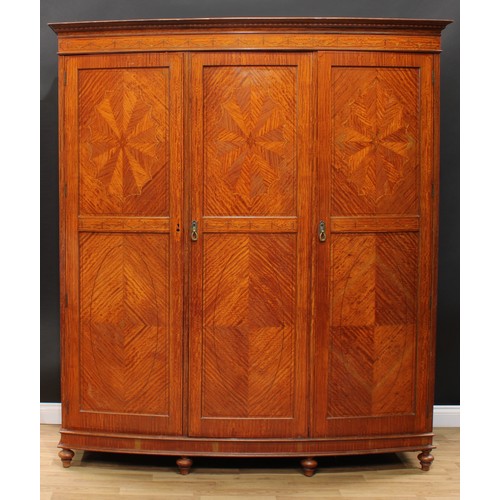 10 - A Sheraton Revival satinwood and marquetry two-piece bedroom suite, comprising wardrobe and dressing... 