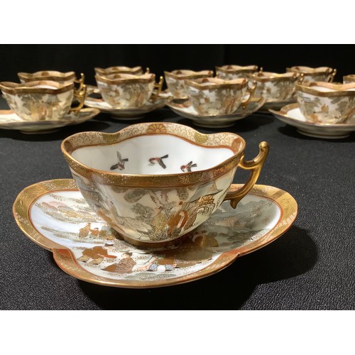 21A - A Japanese egg shell coffee service, for twelve, comprising quartrefoil shaped cups and saucers, dec... 