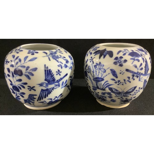 31 - A pair of 19th century Chinese ovoid vases, decorated in underglaze blue with stylised flowers and b... 