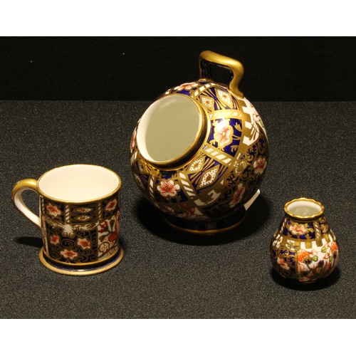 57 - A Royal Crown Derby Imari miniature salt pig; a miniature vase; a Porter mug, a/f (3)
