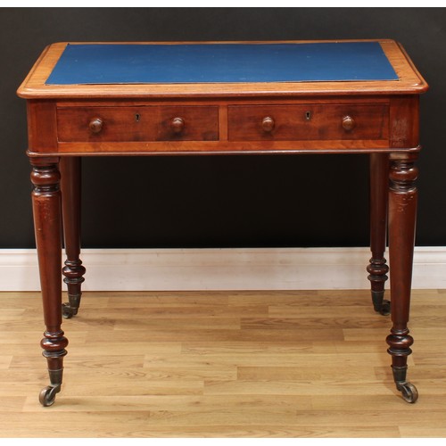 5 - A Victorian mahogany writing table, rounded rectangular top above a pair of frieze drawers, turned l... 