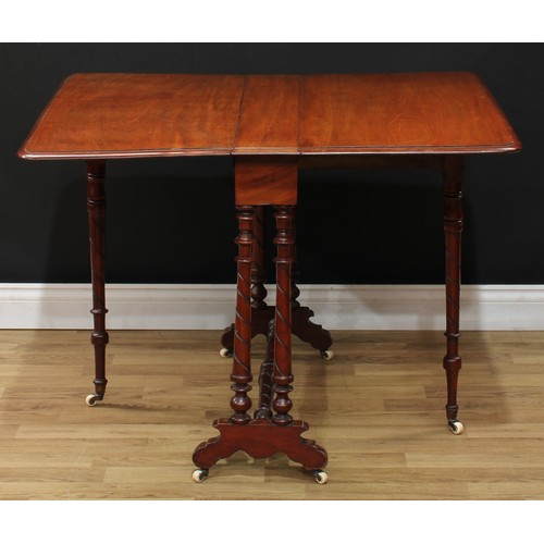 9 - A Victorian mahogany Sutherland table, rounded rectangular top with fall leaves, spirally incised le... 