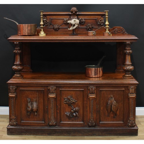 11 - A late Victorian oak two-tier buffet, rectangular top with tall half gallery carved and applied with... 