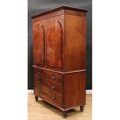 15 - A 19th century mahogany linen press, moulded cornice above a pair of doors enclosing five sliding tr... 