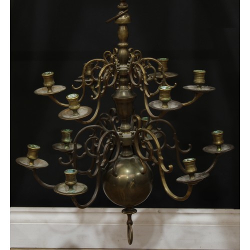 19 - A Dutch brass two-tier twelve light chandelier, drilled for electricity, 67cm high