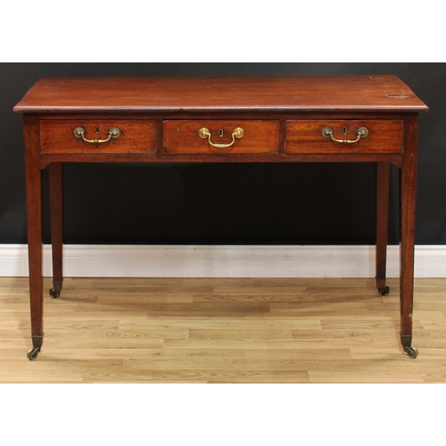 20 - A George III mahogany side table or writing table, slightly oversailing rectangular top above three ... 