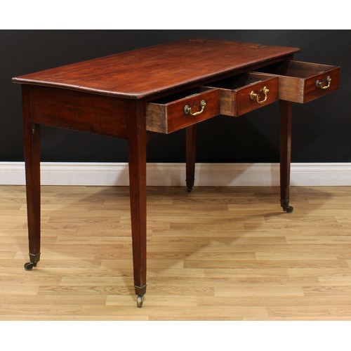20 - A George III mahogany side table or writing table, slightly oversailing rectangular top above three ... 