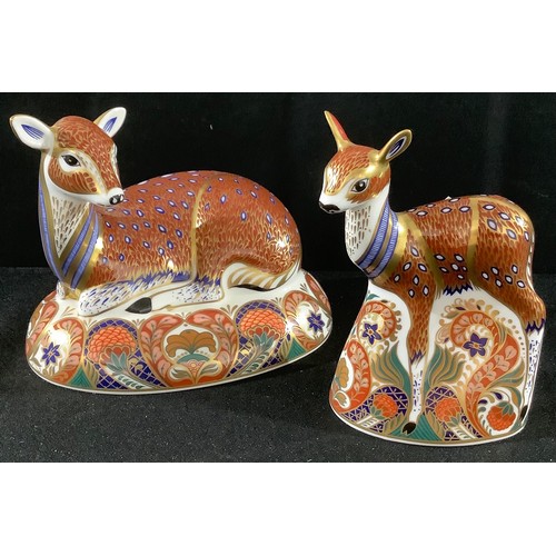 12 - A Royal Crown Derby paperweight, Collectors Guild, Deer, gold stopper, boxed;  a similar fawn (2)