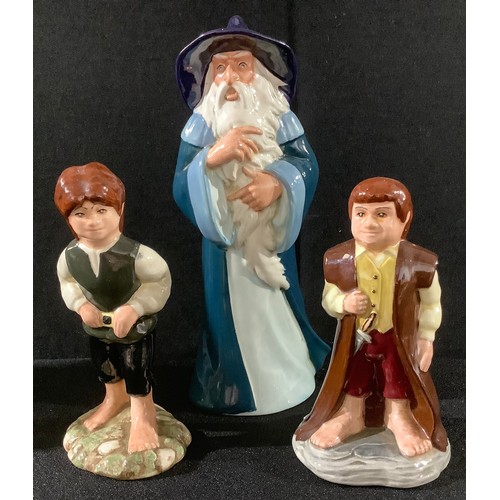 15 - A set of three Royal Doulton The Lord of the Rings Middle Earth figures, Gandalf HN2911, Bilbo HN291... 