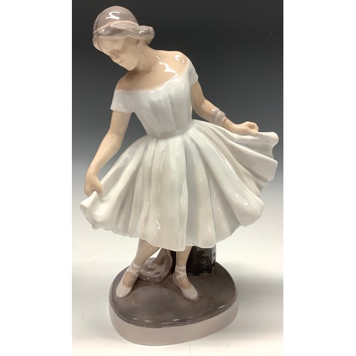 28 - A Royal Copenhagen figure, Ballerina, modelled by Lotte Benter, number 1374, 29.5cm, inscribed, prin... 
