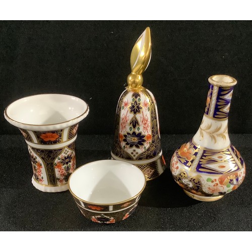 29 - A Royal Crown Derby Imari 1128 pattern flared miniature vase, 6.5cm; a miniature sugar bowl; a candl... 