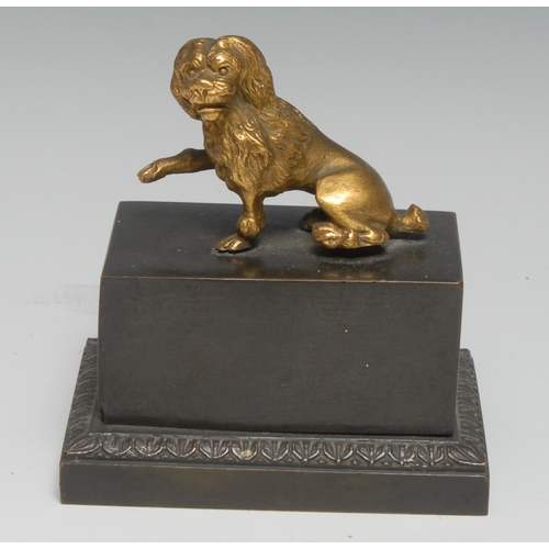 47 - A 19th century dark patinated and gilt bronze encrier, the push-fitting cover surmounted by a dog, e... 
