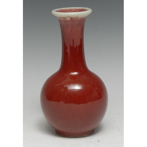 52 - A Chinese monochrome ovoid vase, mottled sang de boeuf glaze, 16cm high, blue seal mark