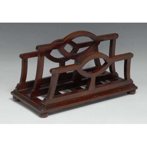 57 - An unusual Edwardian mahogany table top canterbury stationery rack, shaped divisions, bun feet, 31.5... 
