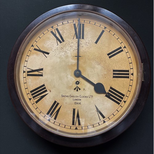 104 - WW2 British WD marked Smith's Bakelite wall clock, dated 1944. 33cm dial. 42cm overall width. Wooden... 