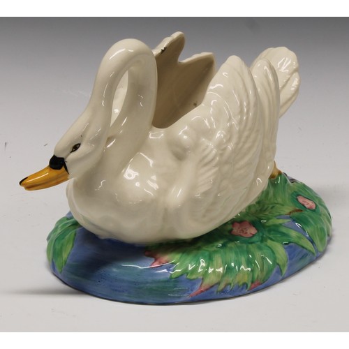 4 - A Clarice Cliff posy holder modelled as a swan swimming on an oval lily pad pond, printed mark, 26cm... 