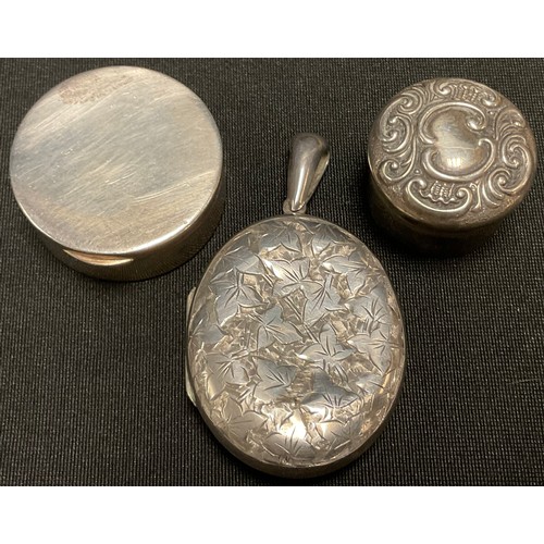 55 - A silver pill box, Birmingham 1904; another, Birmingham 1926; a silver locket (3)