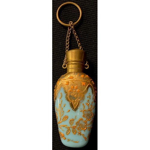 39 - A late 19th century opaque blue glass salts or scent bottle, applied with leafy foliate scrolls in r... 