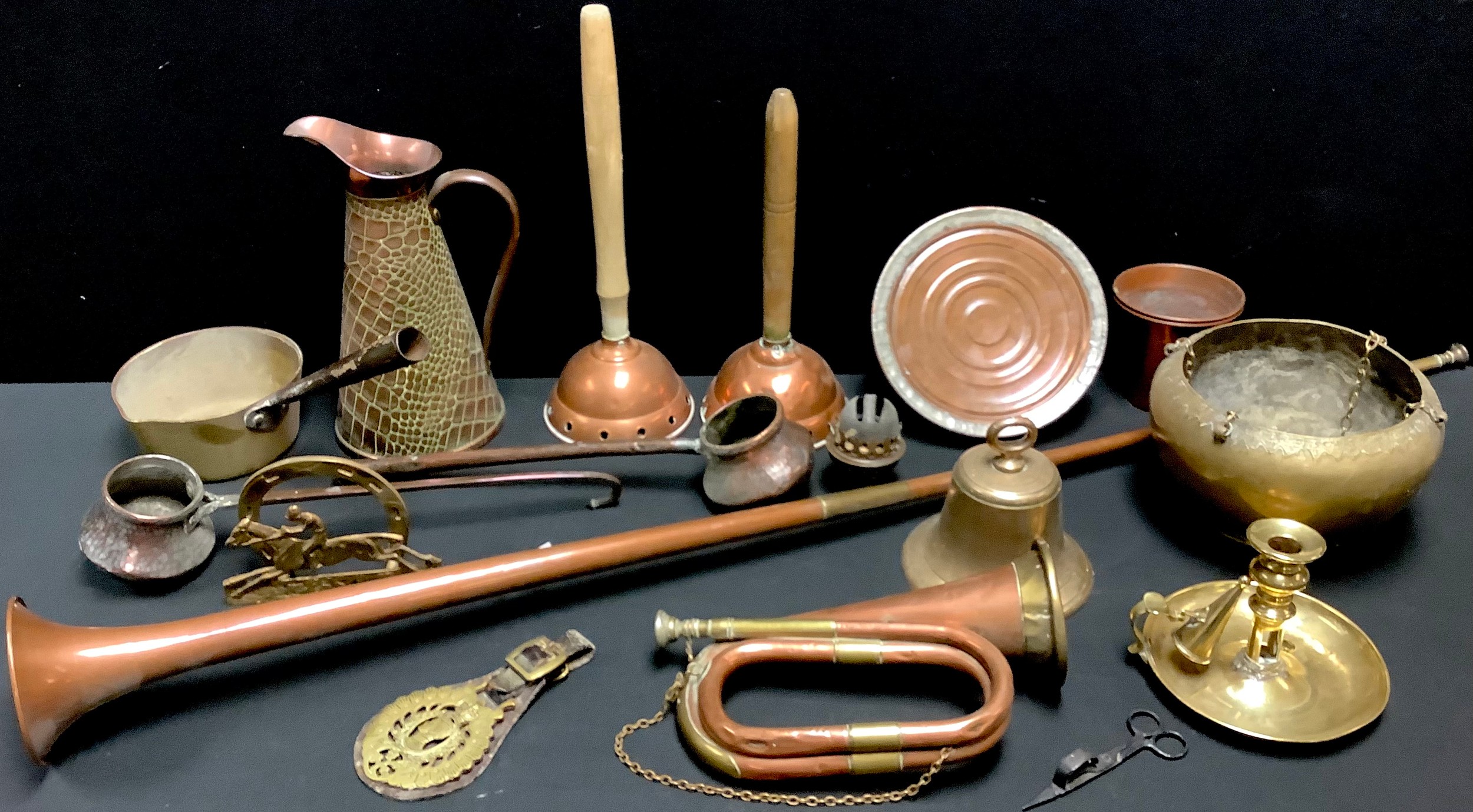 A copper and brass bugle; a copper wash-day ponch, another; a brass school...