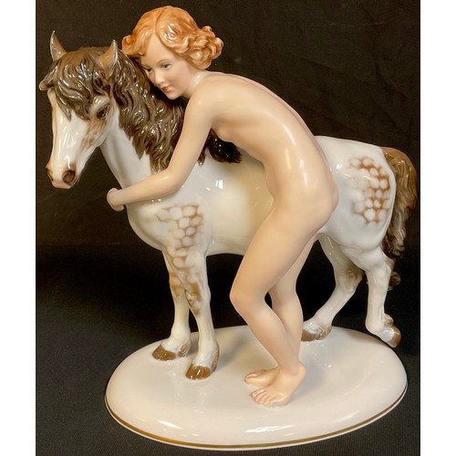 35 - A Rosenthal figure group, designed by M H Fritz, female nude with dappled pony, number 788, 31cm wid... 