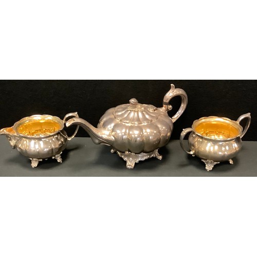 32 - A silver plated Victorian style composed three-piece tea service of melon form, the milk and sugar w... 