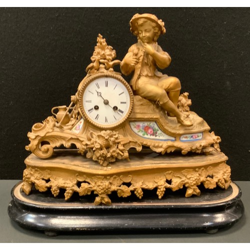 38 - A 19th century French Louis XVI style ormolu and porcelain mantel clock, the case cast as a seated f... 