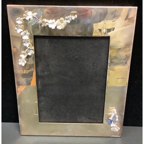 54 - A large silver plated rectangular photograph frame, the broad border applied with enamelled dragonfl... 