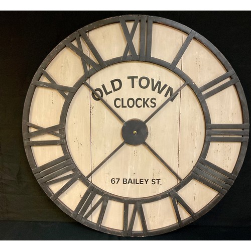 A large contemporary clock face, with Roman numerals, inscri... Barnebys