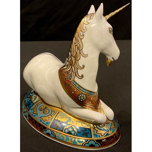20 - A Royal Crown Derby paperweight, Unicorn, designed by Louise Adams to celebrate the New Millennium, ... 