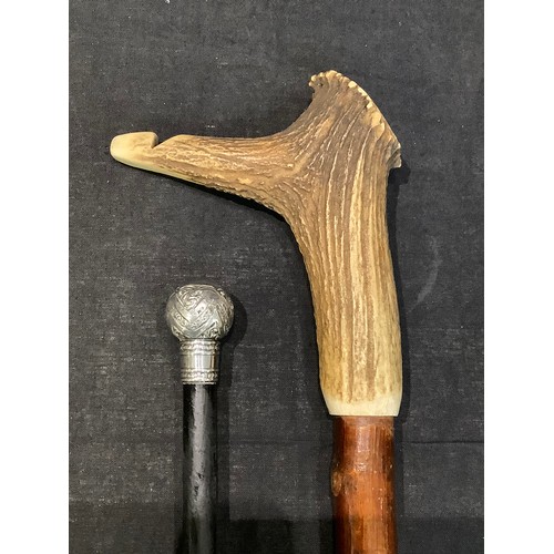 30 - A George V silver mounted walking cane, London 1914; another walking stick, the antler handle with a... 