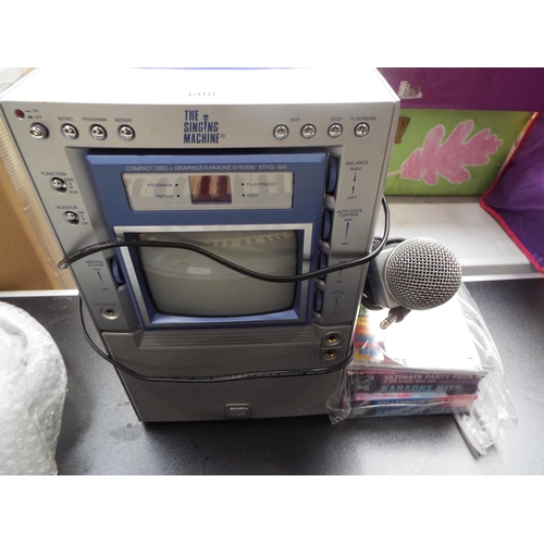 MTV Karaoke Machine together with numerous CD's in working order (S)