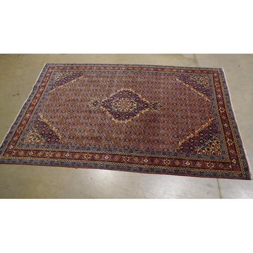39 - Red and blue patterned wool rug 114x78
