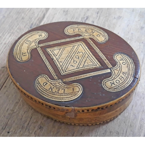 291 - A 17th Century horn and wood snuff box of oval form with verse to top 'It Is A Frend To Whom I Lend'... 