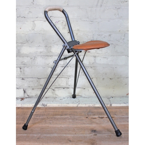 A Shooting Stick Folding Tripod Stool With Stitched Leather Effect