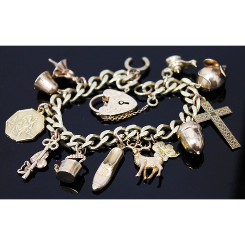 102 - A 9ct gold charm bracelet, gross weight 36.9 grams, each link marked 9 .375, with heart locket clasp... 