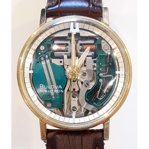 169 - A 1960s gold plated Bulova Accutron wrist watch, diam. 35mm, marked '40 SAD' with original box, book... 