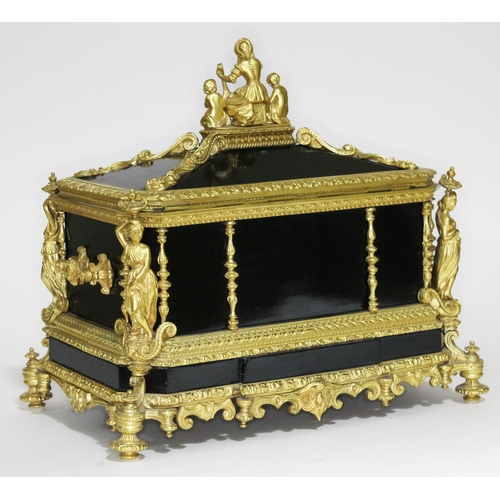 20 - A French 19th century gilt metal and ebonised casket having figural finial and columns, scroll work ... 