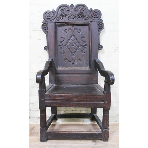 8 - A 17th century oak Wainscot armchair, width 57cm, depth 53cm & height 120cm.