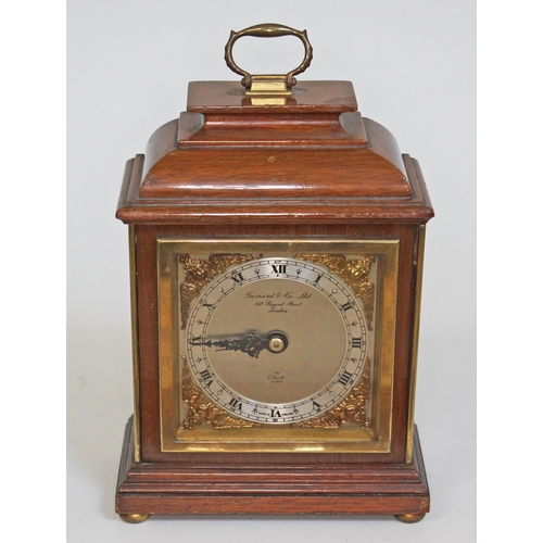 An Elliot Garrard & Co clock, height 22cm.