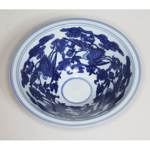 372 - A Chinese porcelain bowl, decorated in blue and white with birds, bearing six character Kangxi mark,... 