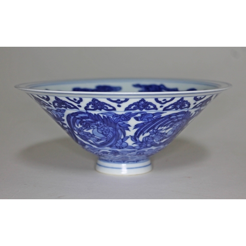 372 - A Chinese porcelain bowl, decorated in blue and white with birds, bearing six character Kangxi mark,... 